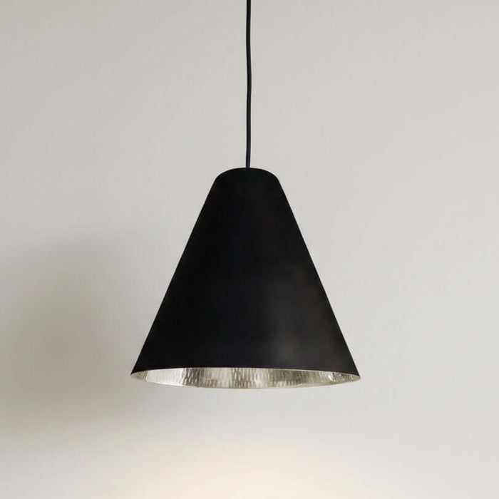 Black pendant light with silver nickel interior