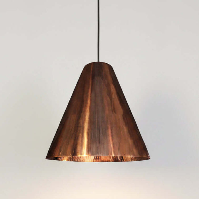 Copper pendant light on a white background