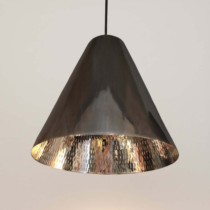 Conical pendant light with metallic finish on a white background