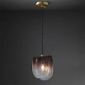 Modern pendant light with a glass shade on a dark background