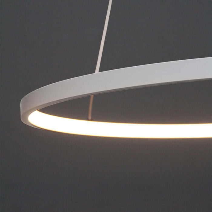 Modern ring light fixture on a dark background