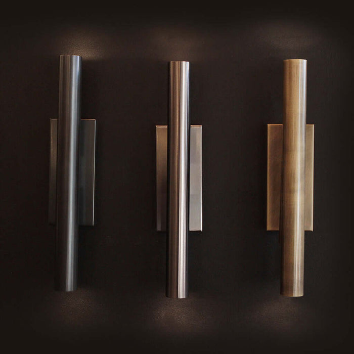 Three wall lights in varying finishes