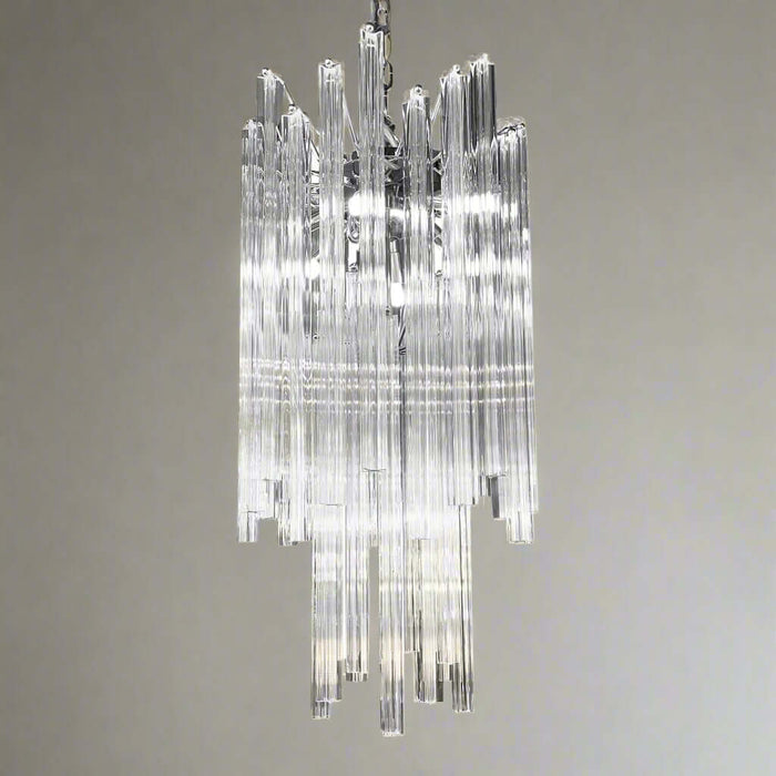 A chrome-finished pendant light fixture with clear prism glass rods arranged in a tiered structure, designed in an art deco style.