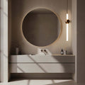 Modern bathroom vanity with round mirror and pendant light